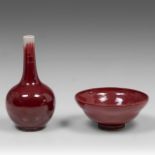 A Chinese red glazed tea bowl, marked, H 7,3 - dia 16,5 cm - and a sang-de-boeuf bottle vase, 19thC,