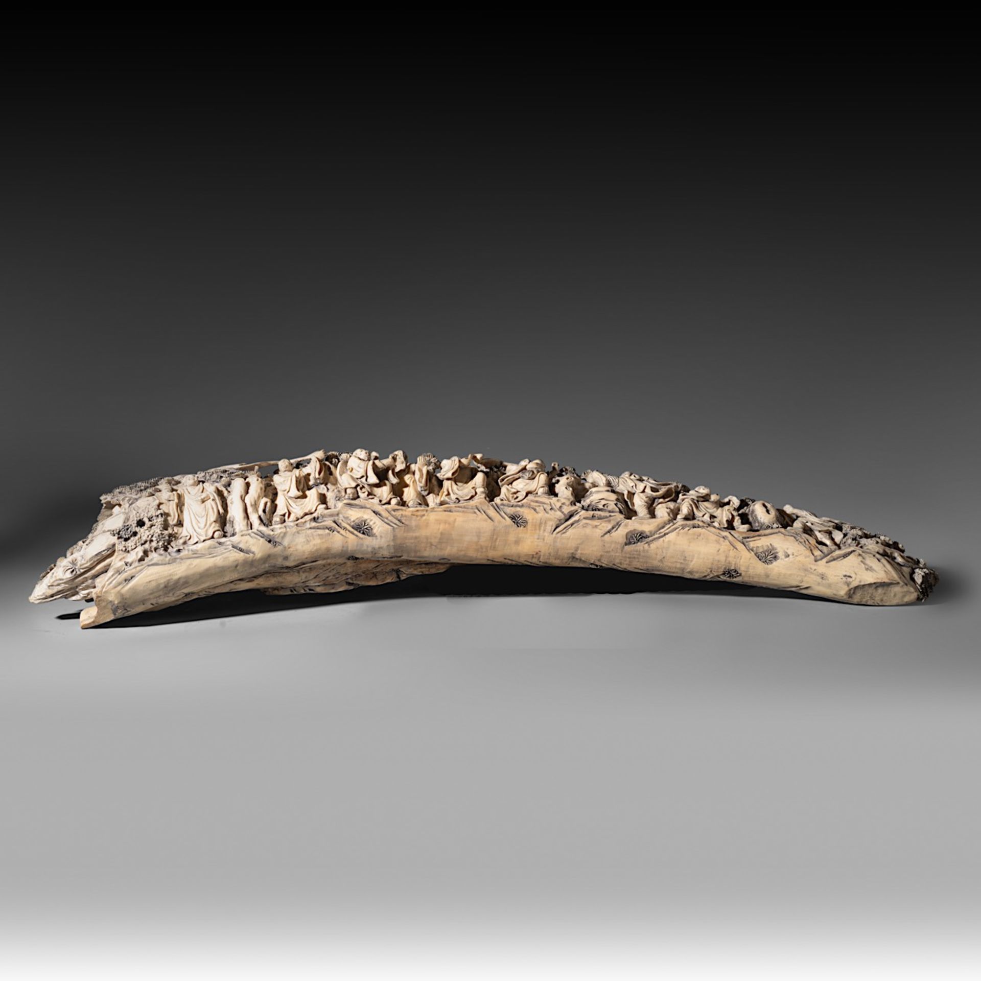 A Chinese late Qing/early Republic carved ivory tusk, on an exotic wooden base, W 85,6 cm - 5700g (+ - Image 7 of 9