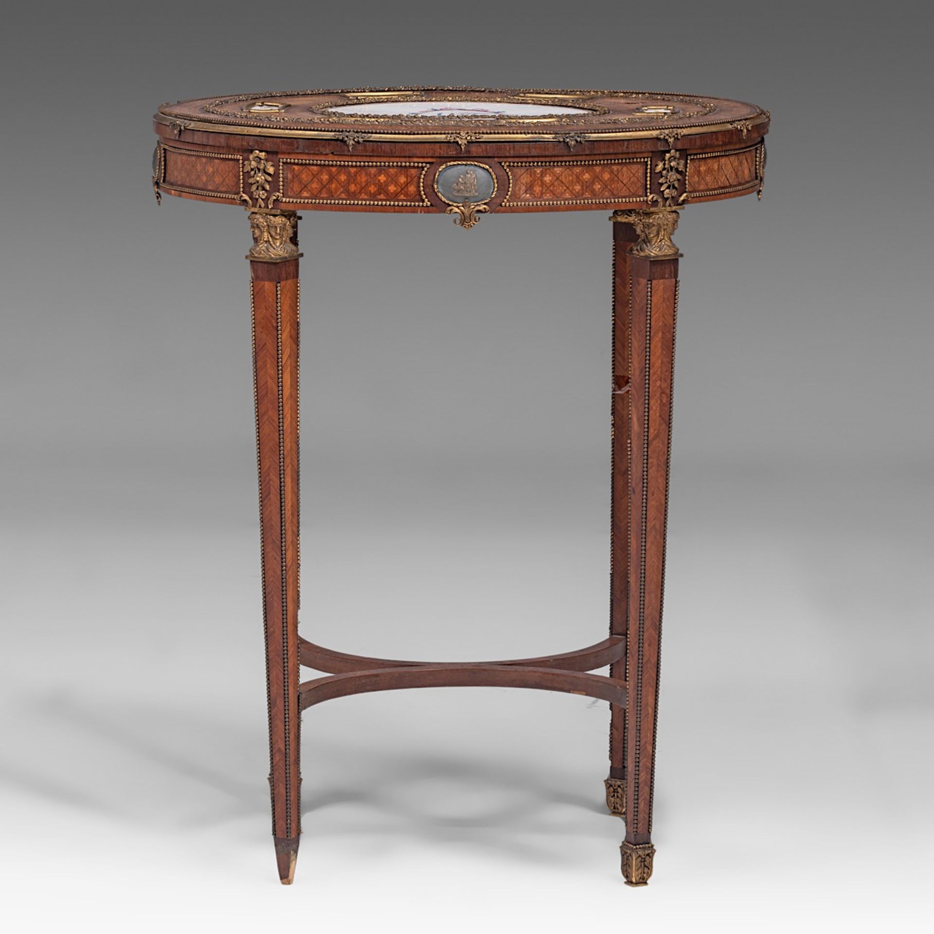 A fine Louis XVI style parquetry occasional table with Sevres porcelain plaques and gilt bronze moun - Bild 2 aus 7