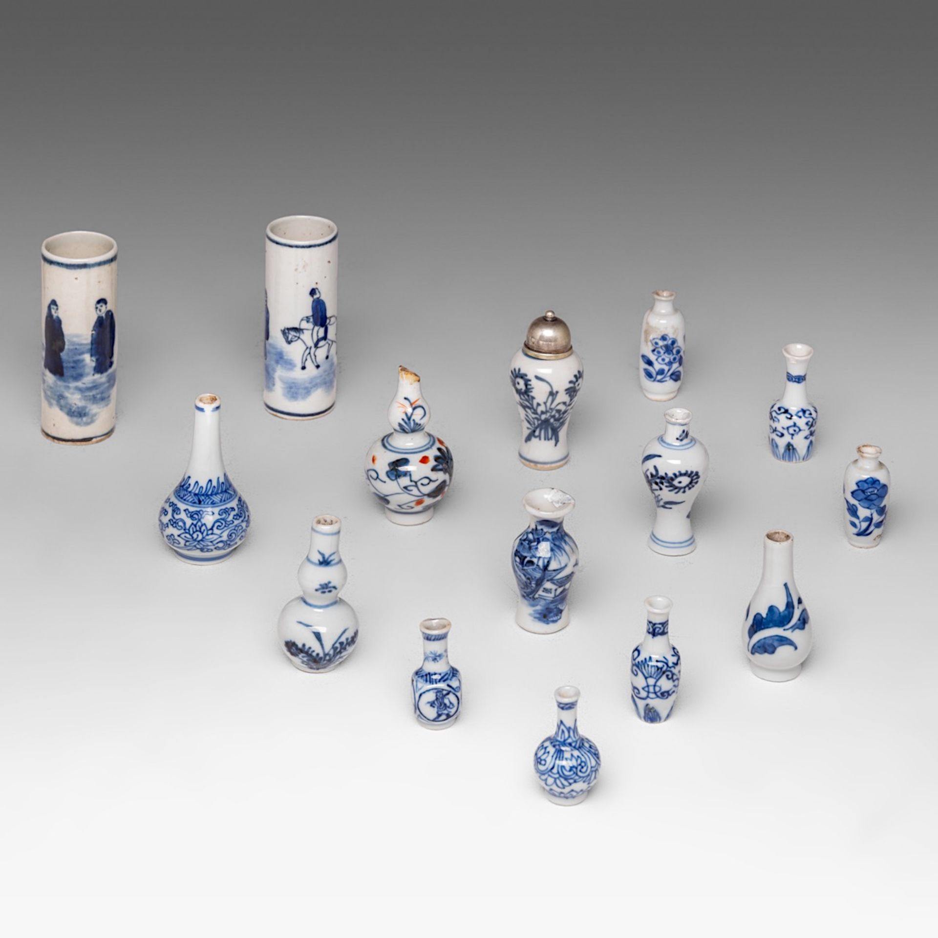 A collection of fifteen Chinese blue and white miniature vases and bottles, Kangxi period and 19thC/