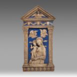 A blue and white glazed terracotta relief of the Virgin and Child in the Della Robbia manner or a fo