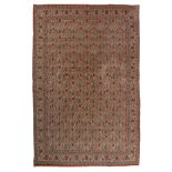 An Oriental floral decorated woollen rug, 223 x 333 cm