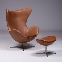 Arne Jacobsen, a brown leather upholstered 'Egg chair' and a matching ottoman