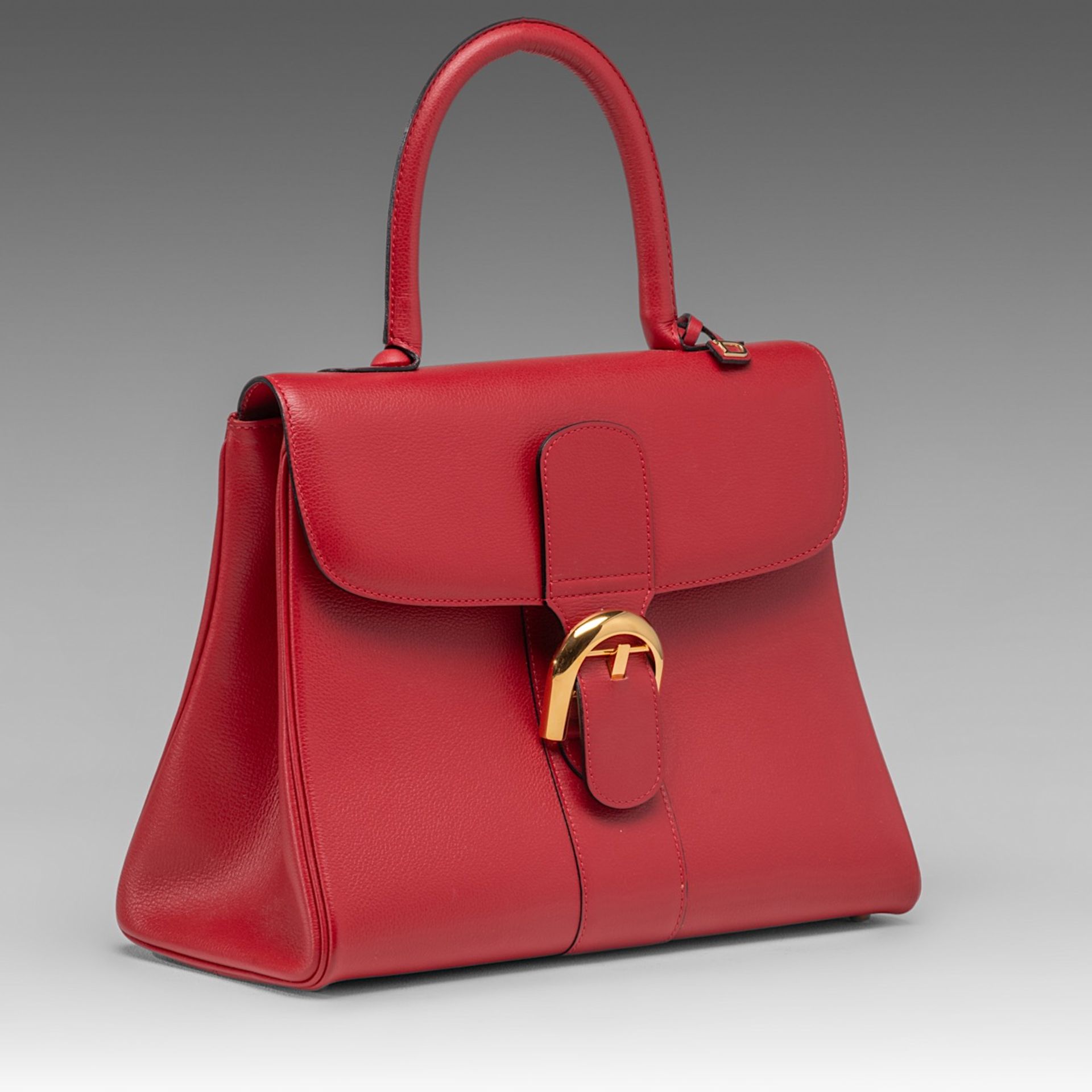 A Delvaux Brillant MM red leather handbag, H 21,5 - W 29 - D 13,5 cm