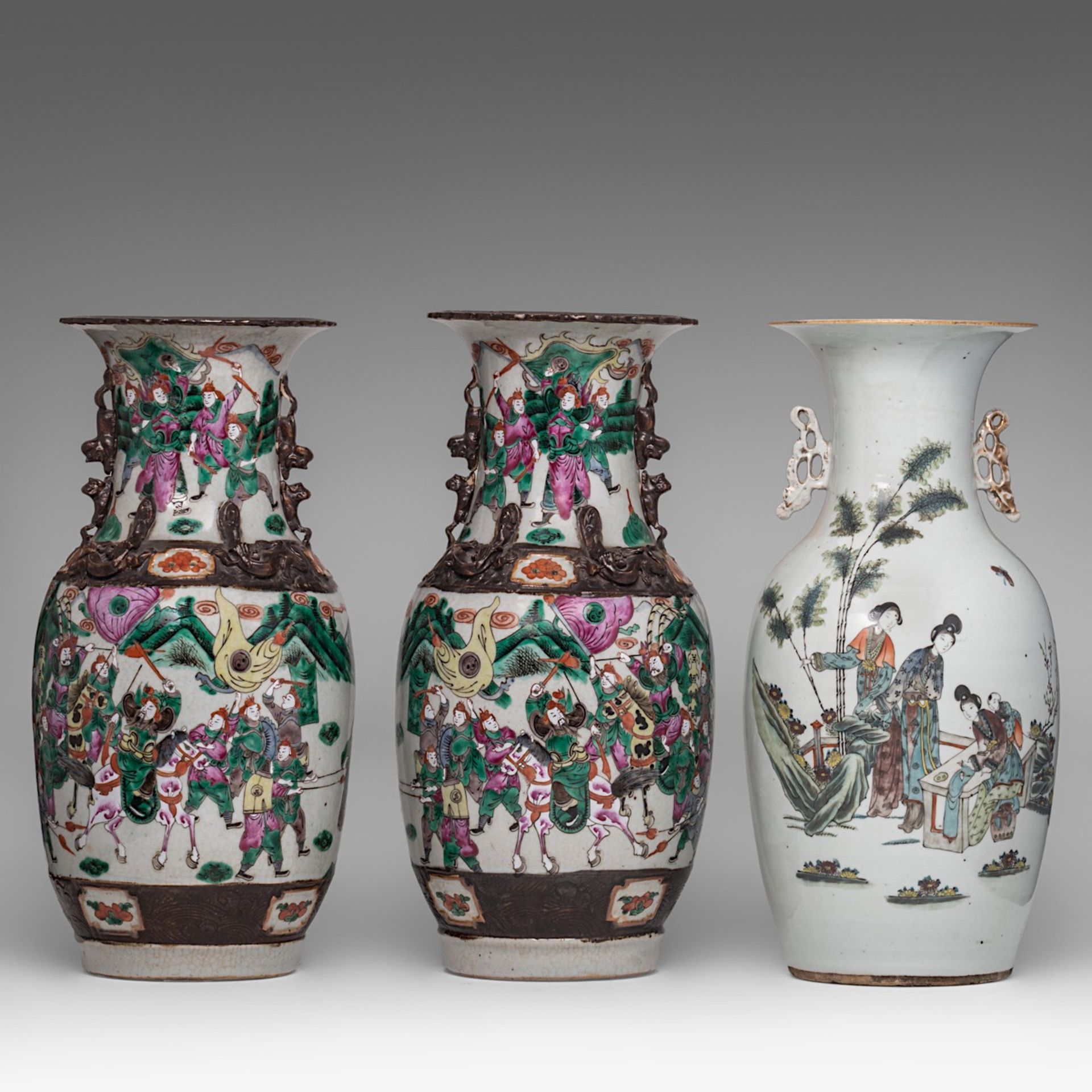 A pair of Chinese famille rose Nanking stoneware vases, 19thC, H 43,5 cm - and a famille rose 'Beaut