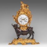 A Rococo style gilt and patinated bronze mantle clock with a large horned bull, 19thC, H 51 cm