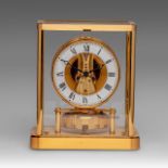 A Jaeger LeCoultre Atmos glass and brass '13 jewels' clock, decorated with rubies, H 22,5 - W 19,5 c