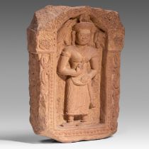 A sandstone fragment depicting a divinity, Khmer, presumably Bayon style, H 62 - W 45 cm