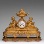 A Louis XVI style gilt bronze mantle clock, decorated with Sevres plaques, H 40 - W 52 cm