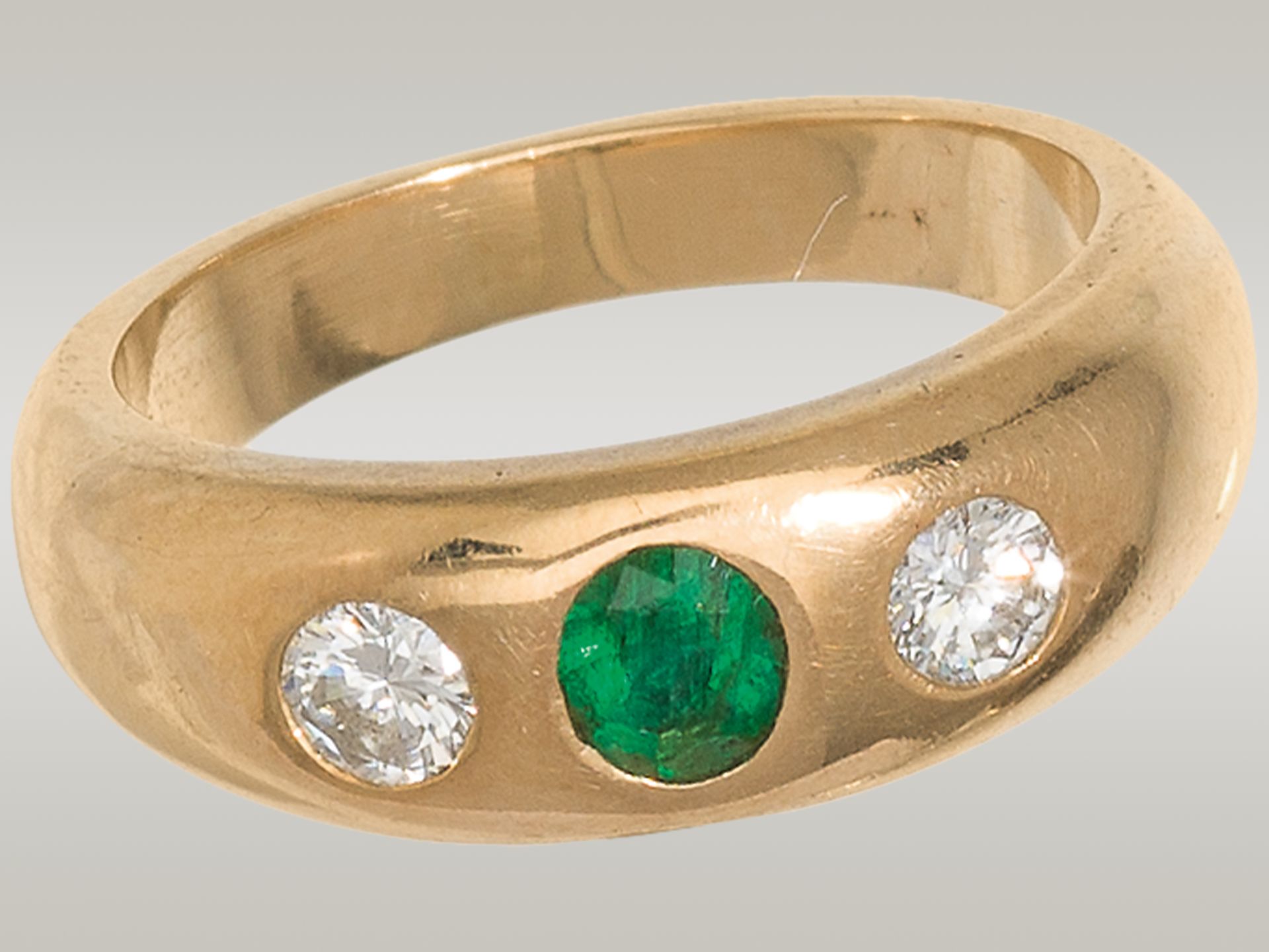 Gold ring with emerald and diamonds