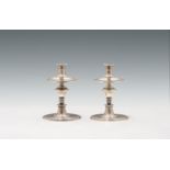 Pair of candlesticks17th centurysilver; unscrewable grommets and drip trays; marked on the bottom
