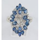 Ring, WG 750, Brillanten und Diamanten zus. ca. 0.87 ct., etwa tw/vs-si, 18 Saphire zus. ca. 2.40 c