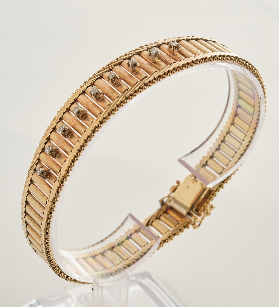 Brillantarmband, GG 585, 9 Brillanten zus. ca. 0.18 ct., Kastenschloss mit Achterhaken, ca. 20 cm l