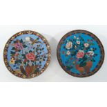 2 Platten, Japan, um 1900, Cloisonné, farbige Blütendekore auf blauem Grund, Randbordüren, ø 30 cm,