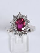 Ring, WG 750, 10 Diamanten zus. ca. 1.50 ct., etwa tw/vsi, Brillantschliff, 1 Rubin ca. 9.1 x 6.3 m