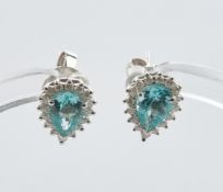 Paar Ohrstecker, WG 750, Brillanten zus. ca. 0.30 ct., etwa w/vs1-si, 2 Apatite zus. ca. 1.32 ct.