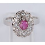 Ring, WG 585, Rubin, 12 Brillanten zus. ca. 0.36 ct., 5 g, RM 12