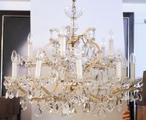 Kristallleuchter, Italien, 20. Jh., 15-flammig, reicher Glasprismenbehang, H. 67 cm exkl. Kette, ø 