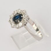 Ring, WG 585, mit 10  Brillanten und einem facettiertem Saphir (leicht angerieben), zus. ca. 0,70ct