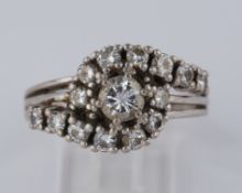 Ring, WG 585, 1 Vollschliff-Brillant ca. 0.35 ct., 14 Besatzbrillanten zus. ca. 0.56 ct., RM 53