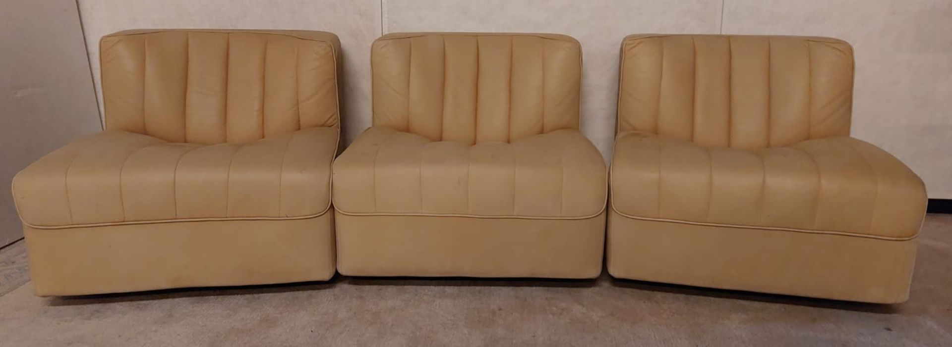Three modular armchairs, leather, circa 1970.