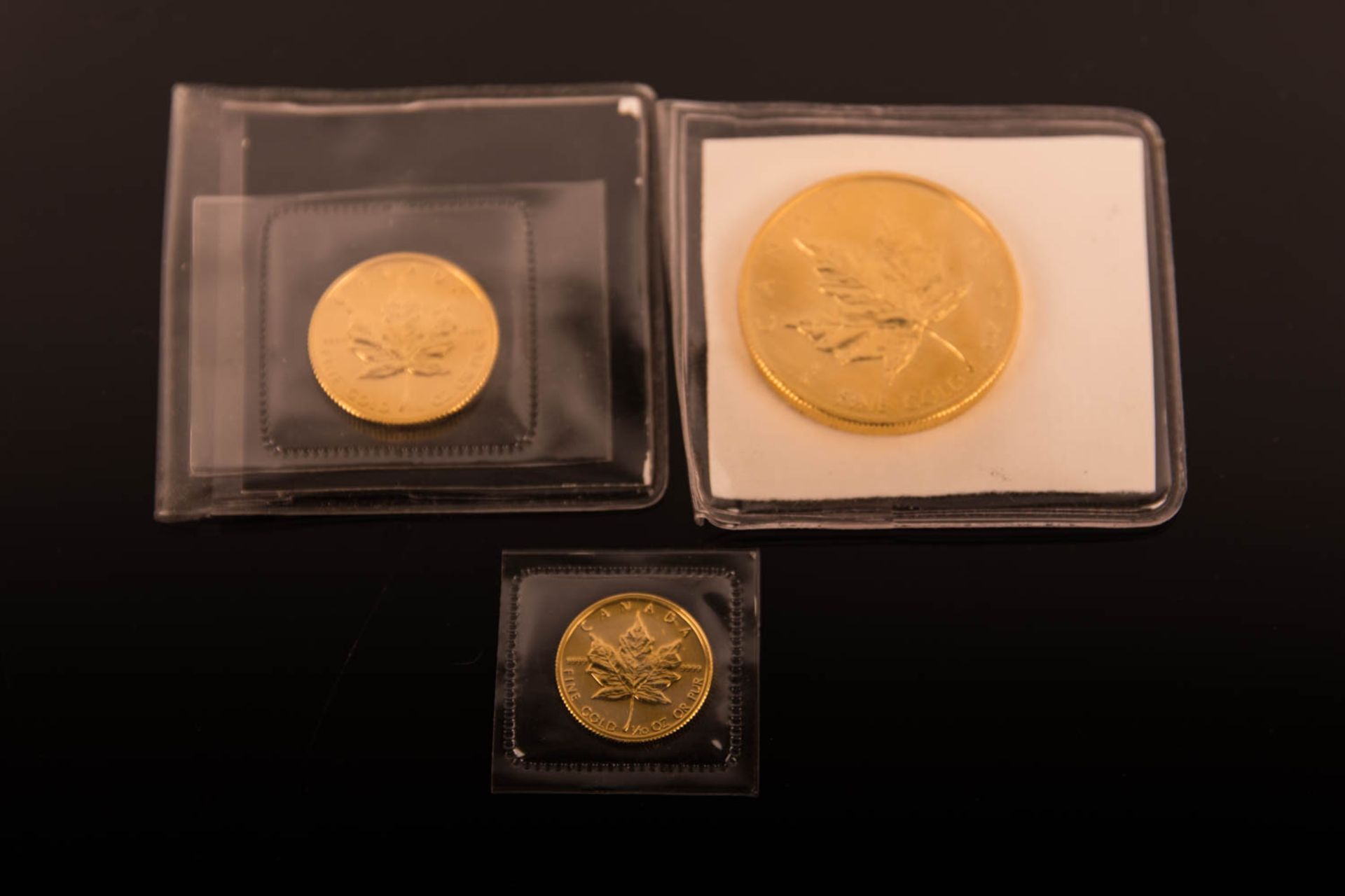 Konvolut von 3 Maple Leaf, Goldmünzen. 1 Unze, 1/4 Unze, 1/10 Unze
