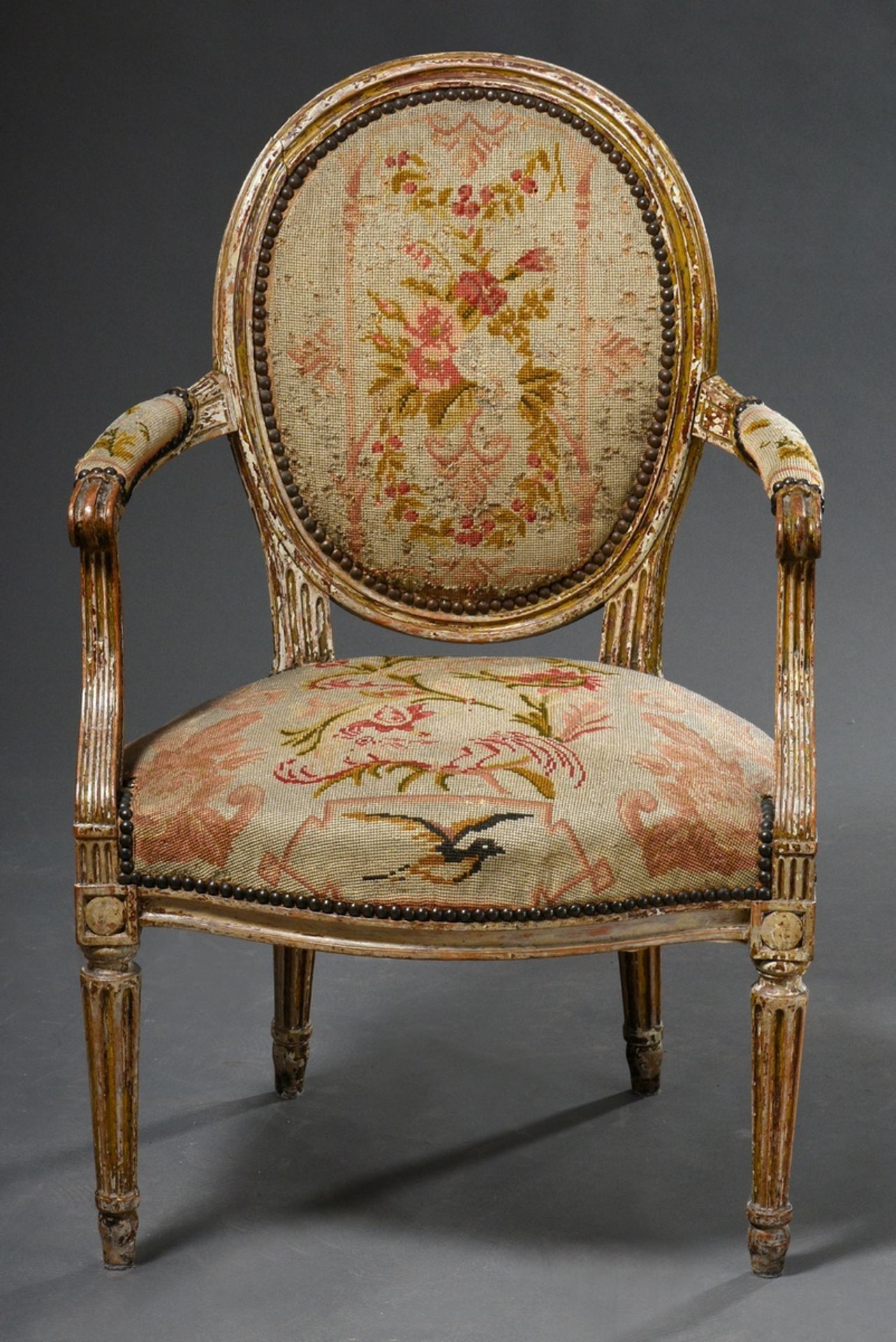 Louis XVI armchair with medallion back and fluted legs and floral embroidery cover, wood with remna