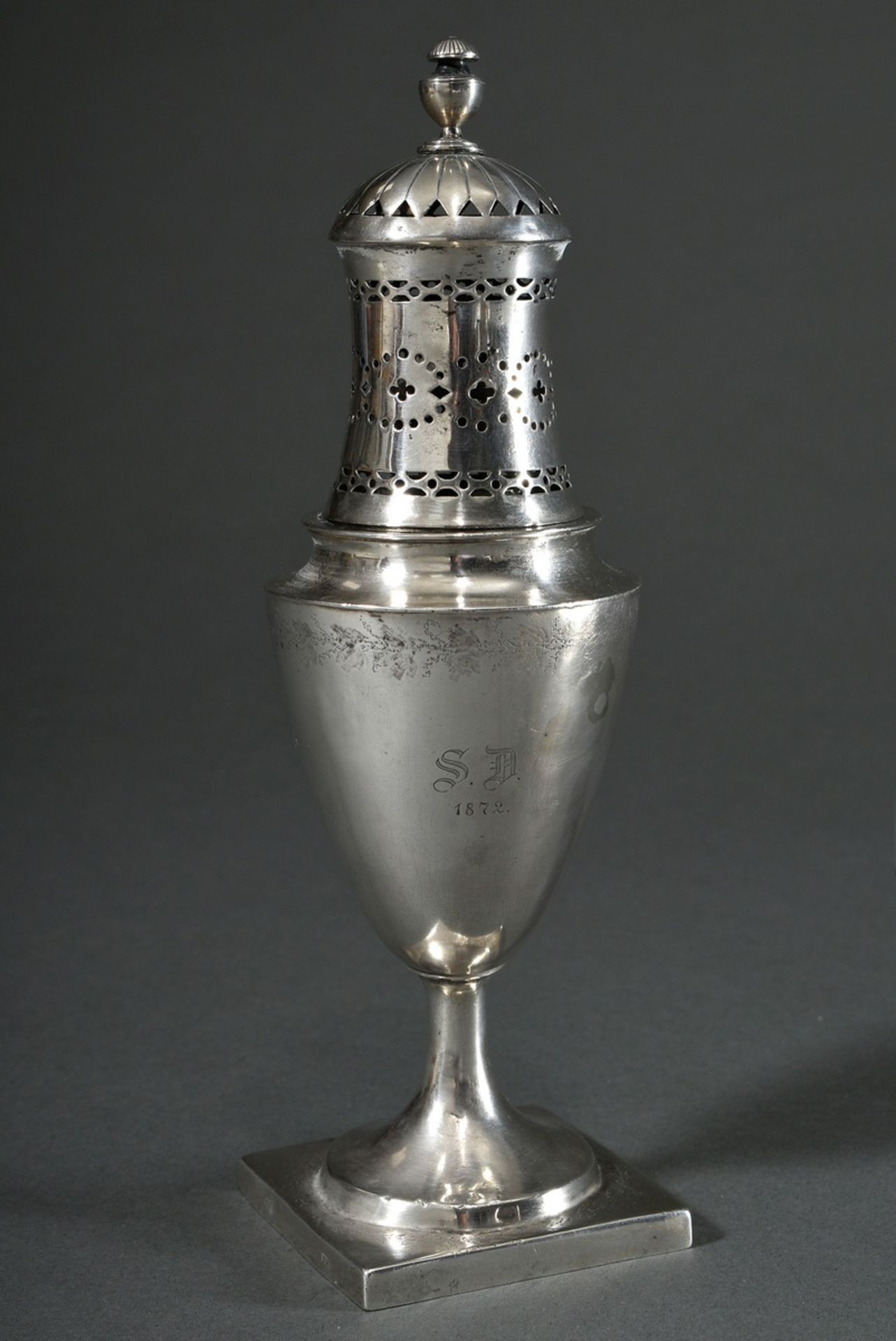 Classicist urn-shaped sugar sprinkler on a high, angular base with delicately engraved floral friez