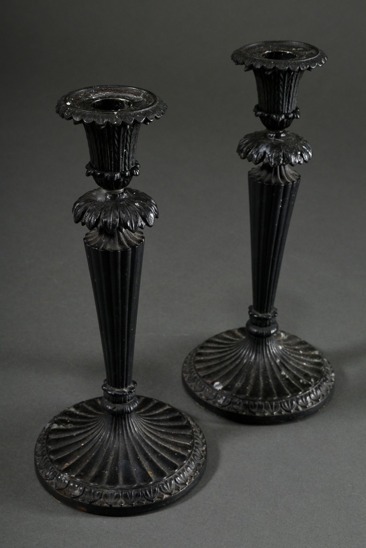 Pair of small Berlin iron candlesticks with fluted shaft and palmette decoration, black lacquered, 