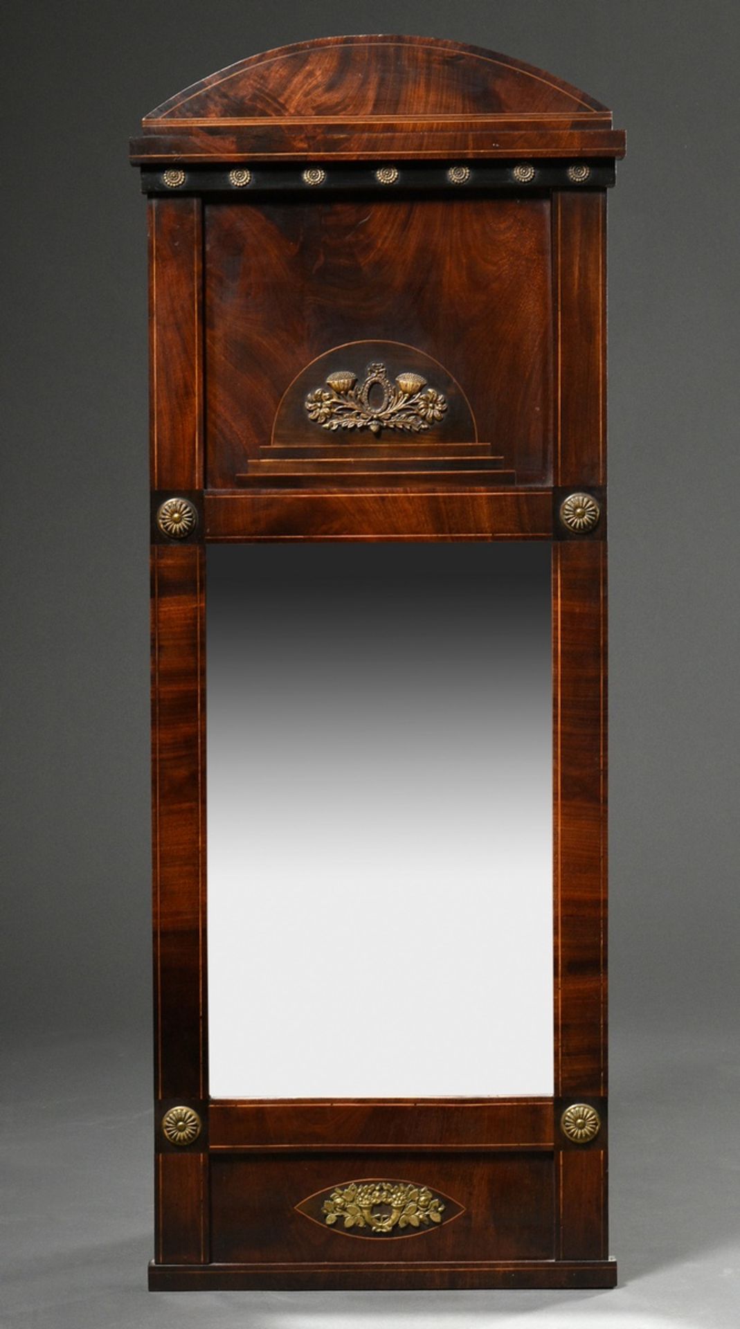 Biedermeier console mirror with floral brass rosettes and fittings on a mahogany frame with ebonise