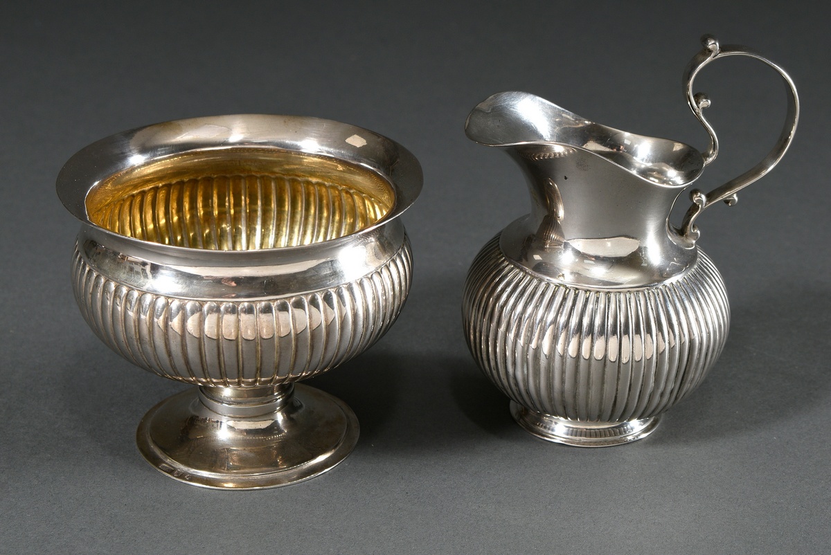 2 Various pieces: cream jug and sugar pot with grooved body, uninterpreted hallmark "'Two Swords", 