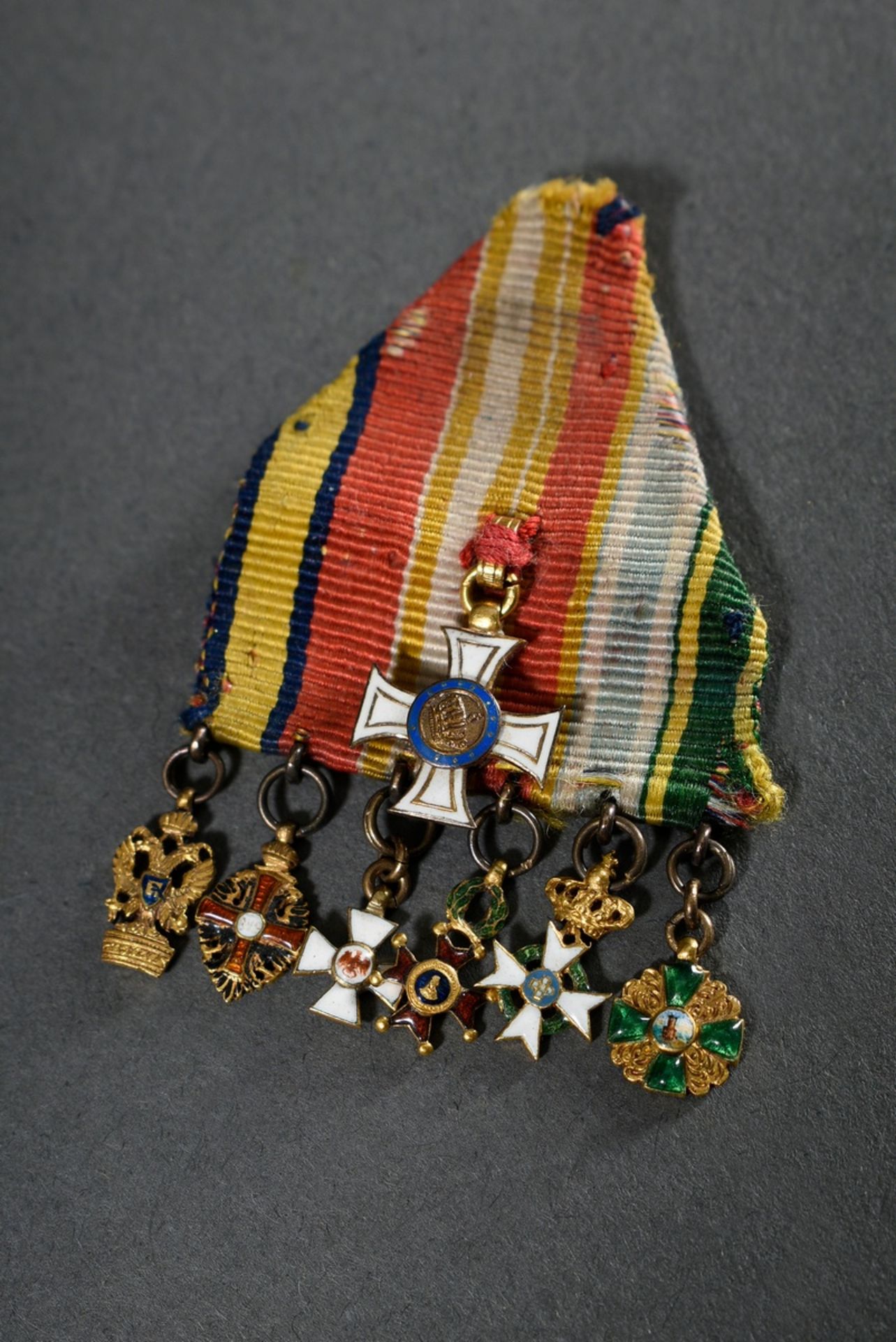 Fragment of a ribbon buckle with 7 miniatures of orders in especially small design, 19th century: R