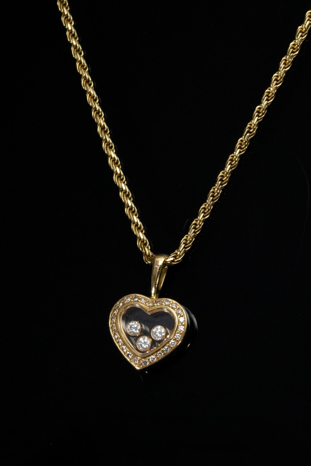 750 yellow gold Chopard "Happy Diamonds" necklace: heart pendant with three free-moving brilliant-c