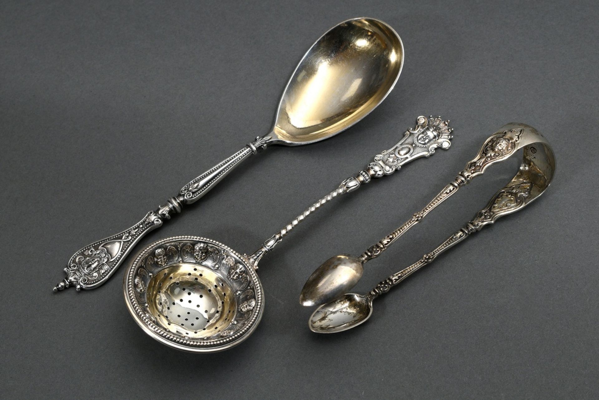 3 pieces Historism cake servers with rich relief decoration and mascaron ornamentation, German end 