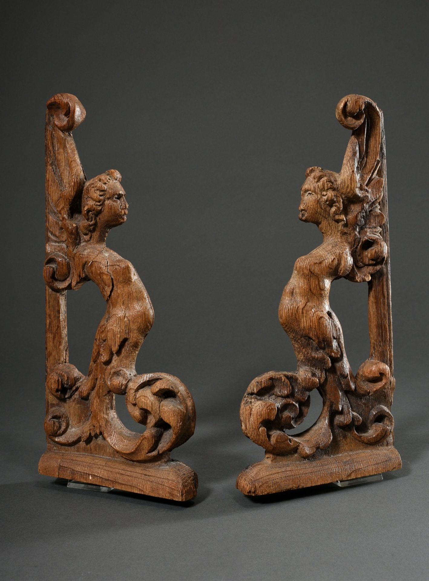 Pair of antique carvings "Harpies", formerly part of a piece of furniture, oak, 32x15x4cm, slightly