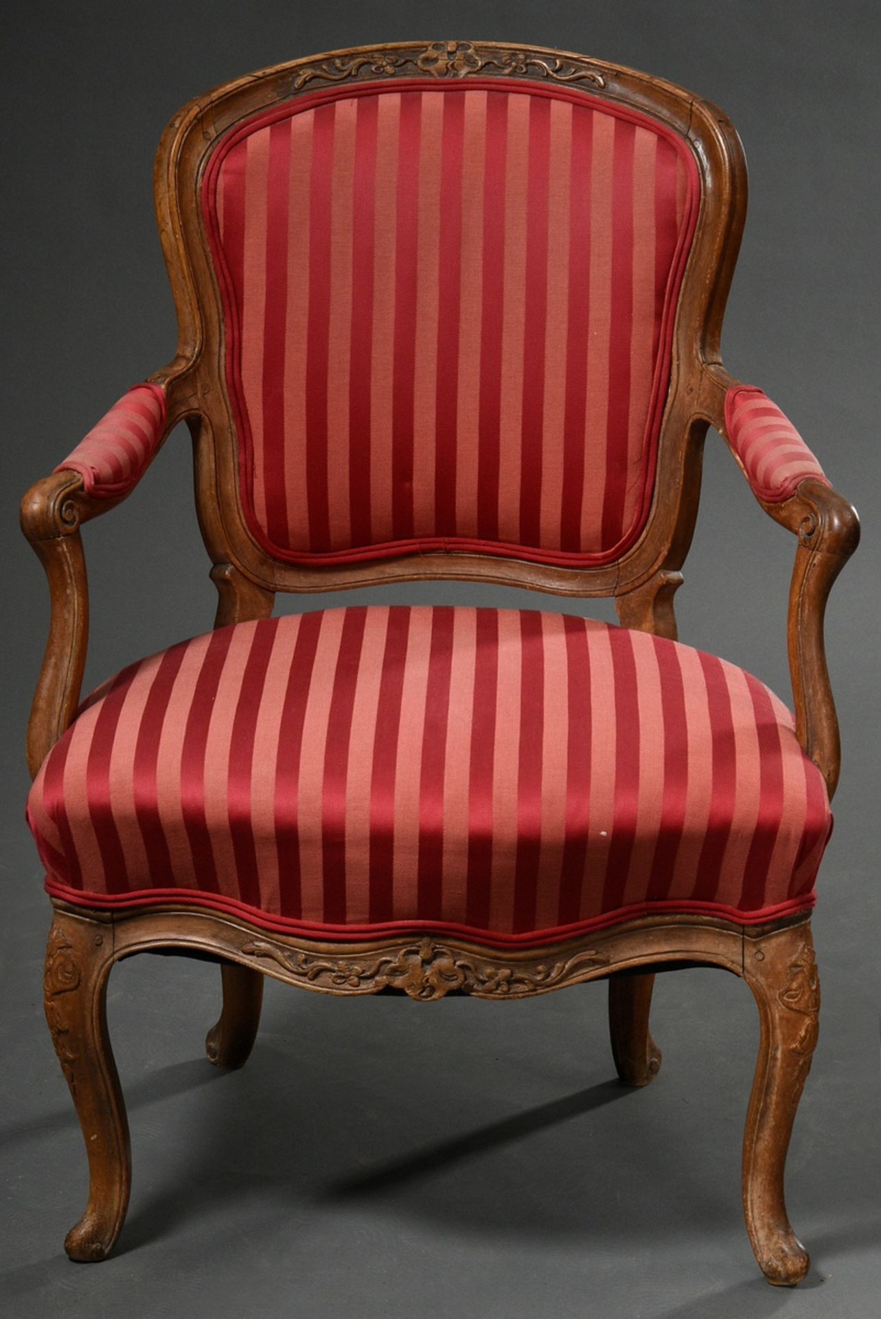 French armchair with curved legs and red striped silk cover, walnut/beech, h. 44/86cm, wood partly 
