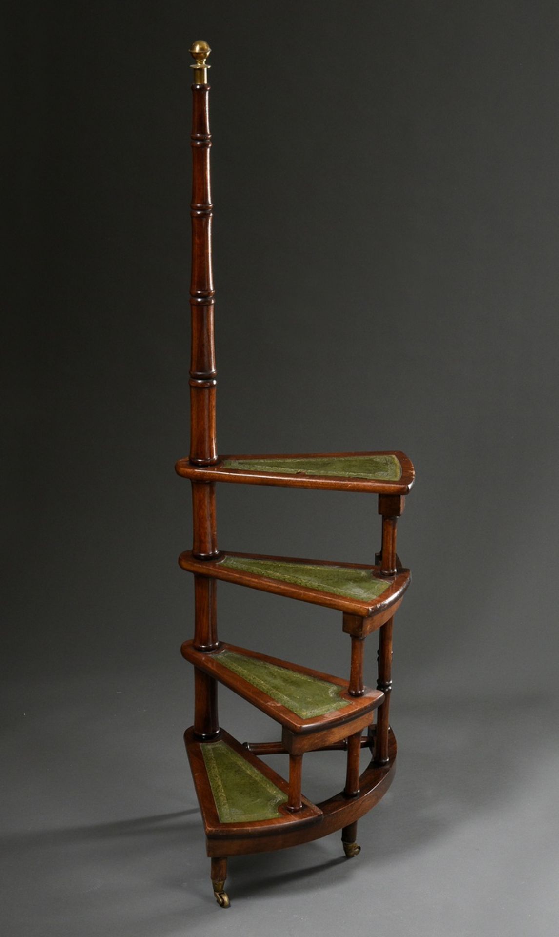 Four-stepped library staircase on brass castors, mahogany with green gold-punctured leather, h. 81/