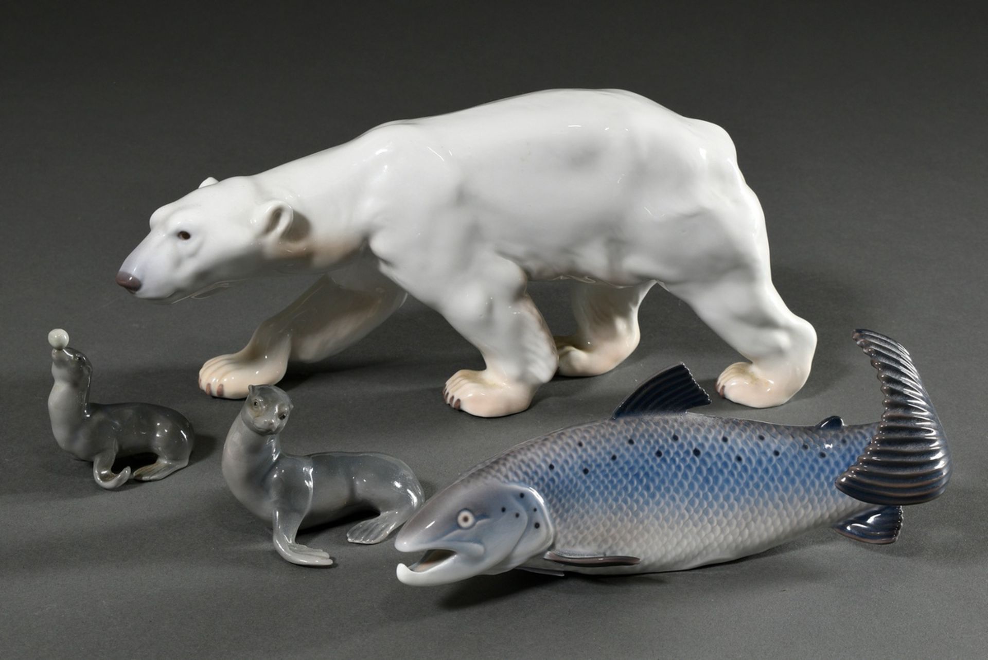 4 Various porcelain figures "Striding Polar Bear", "Salmon Trout", "Seal" and "Seal with Ball" with