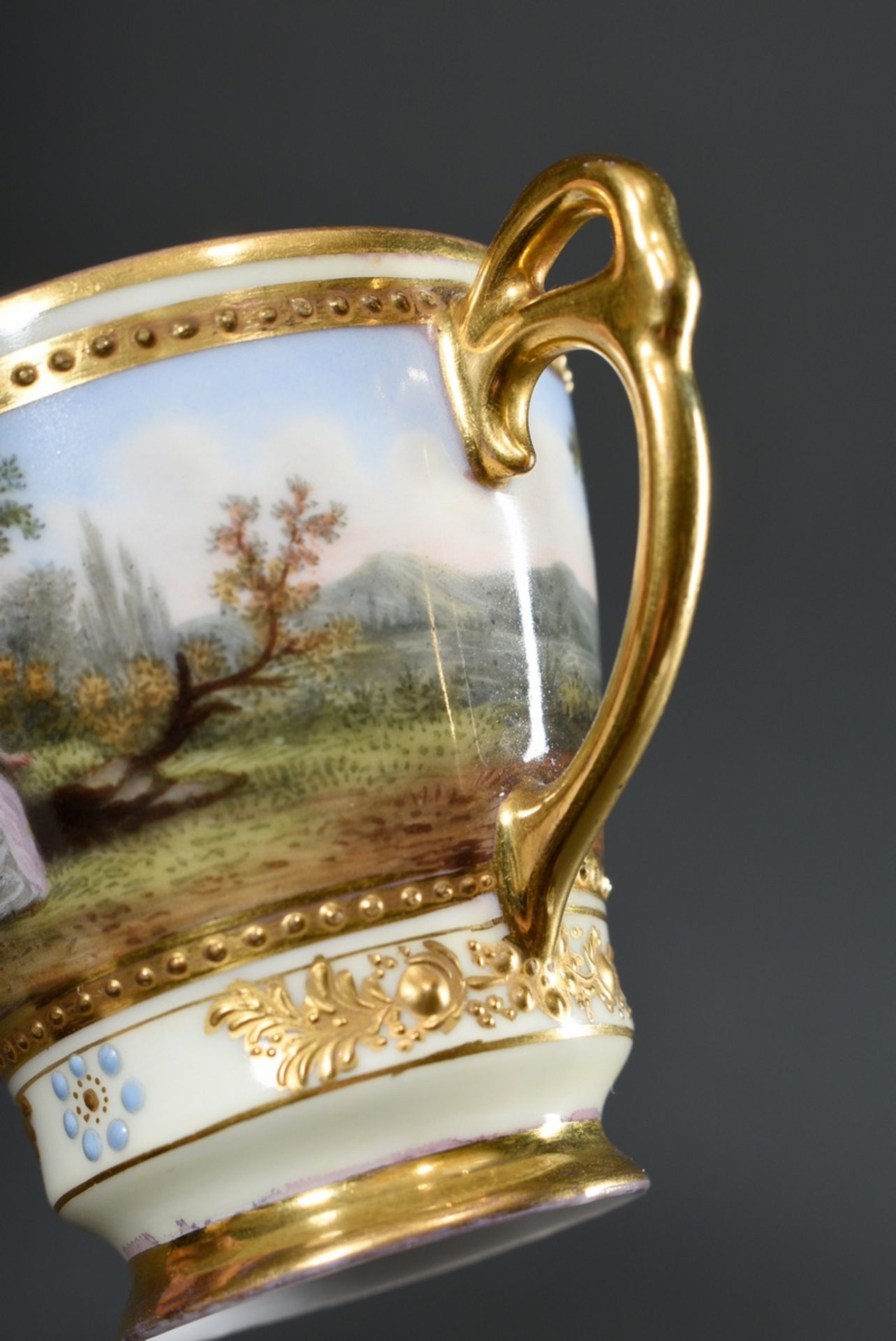 Dresden demitasse/saucer with polychrome painting " Watteau scene" and rich relief gilding on a lig - Image 5 of 7