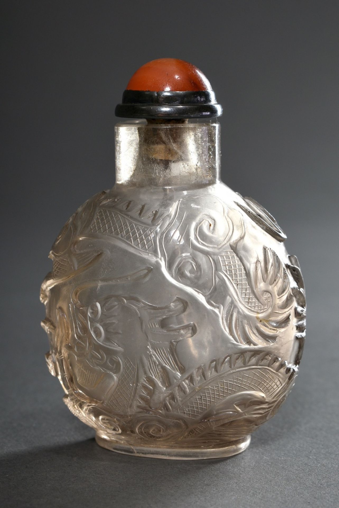 Rock crystal snuffbottle with finely cut "sky dragon" decoration in relief, thin-walled hollowed, C