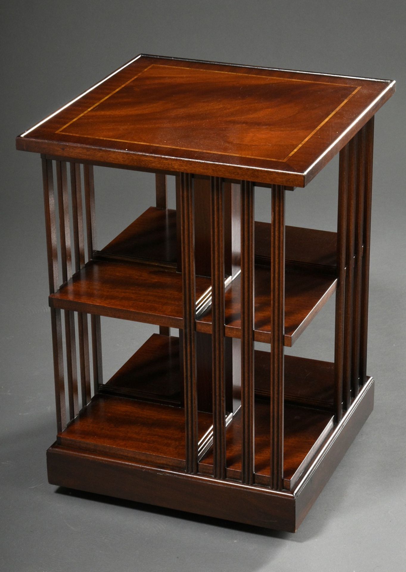 English revolving bookcase in mahogany with ribbon inlays, can be loaded from all sides, around 190