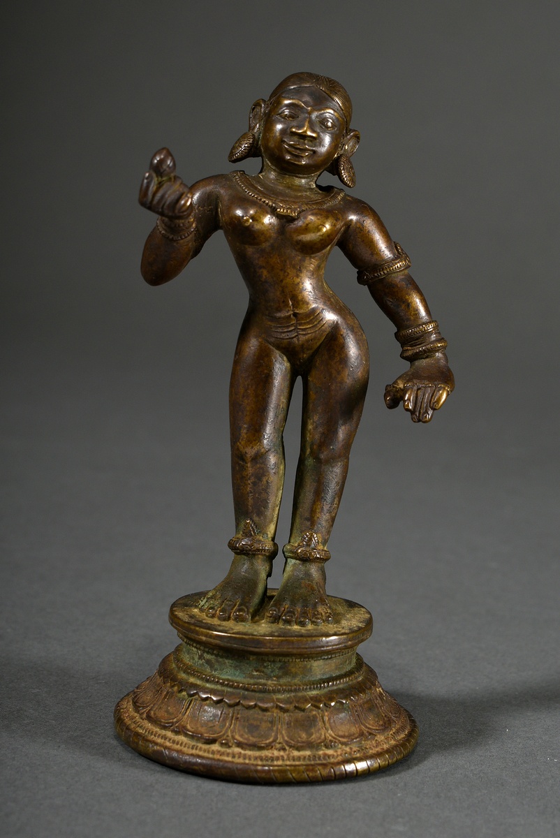 Bronze figure "Sri Devi with lotus blossom in her right hand" on a round lotus base, India 18th c.,