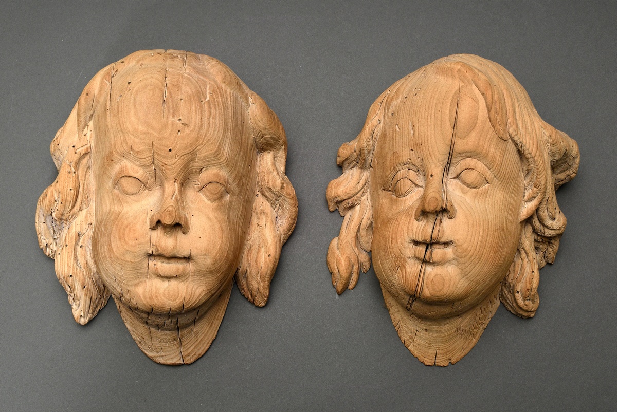 2 Baroque angel or putto heads, 18th century, softwood carved, not set, 24x19/24,5x21cm, old worm d