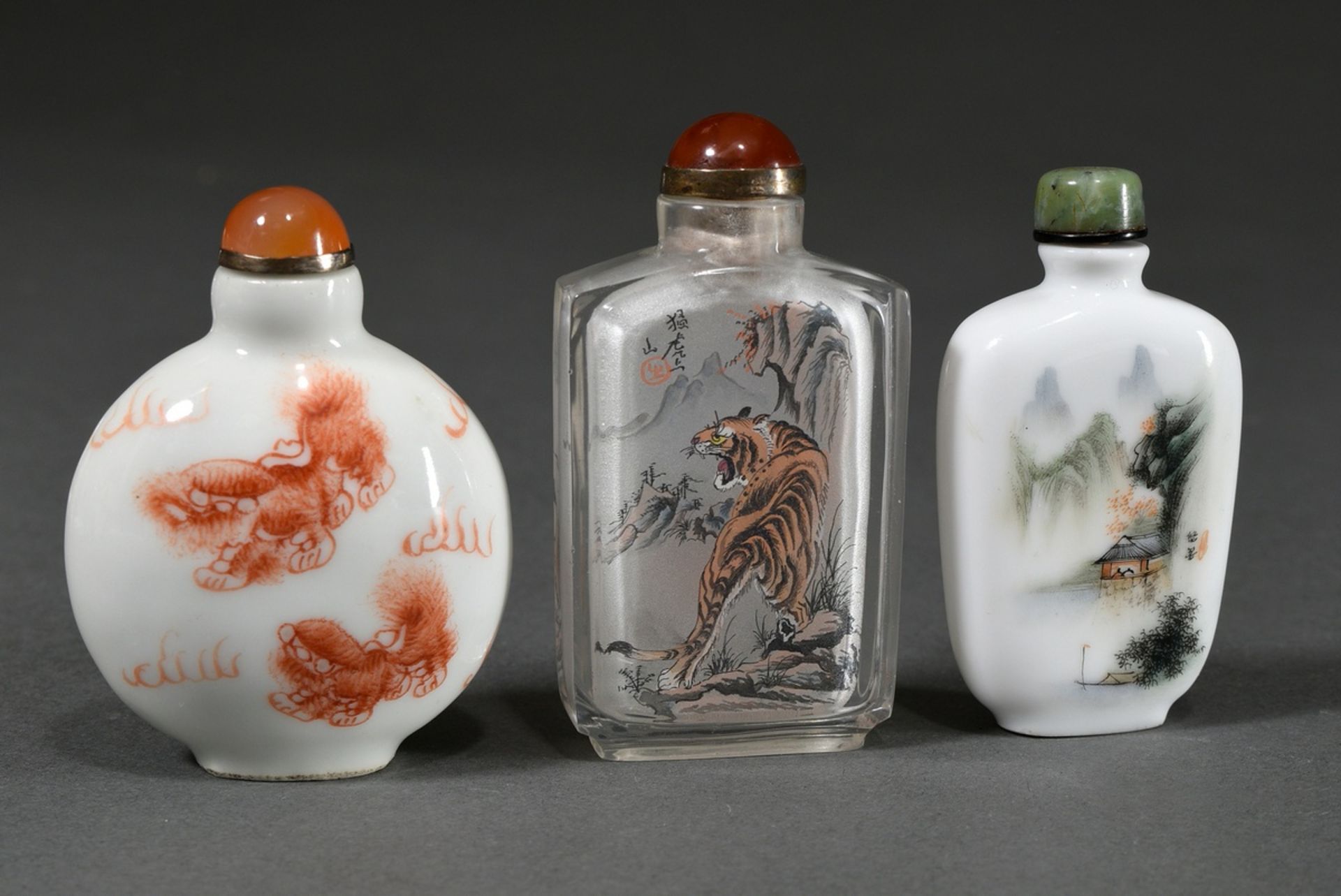 3 Various snuffbottles: Porcelain with Fo lion decoration, 4-character Qianlong mark / White opaque