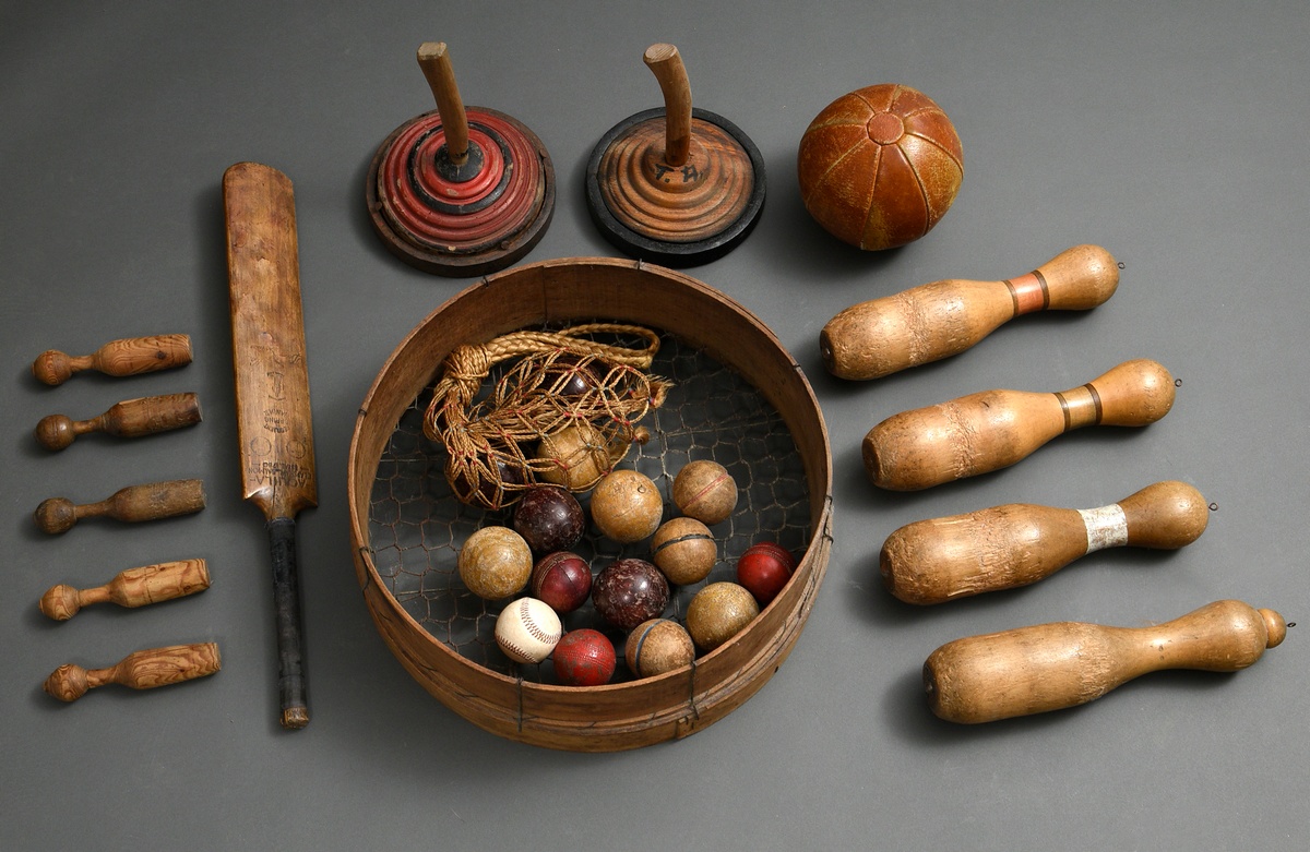 28 pieces of old sport and play equipment: i.a. ice sticks (Ø 24cm), big and small wooden cones (h.