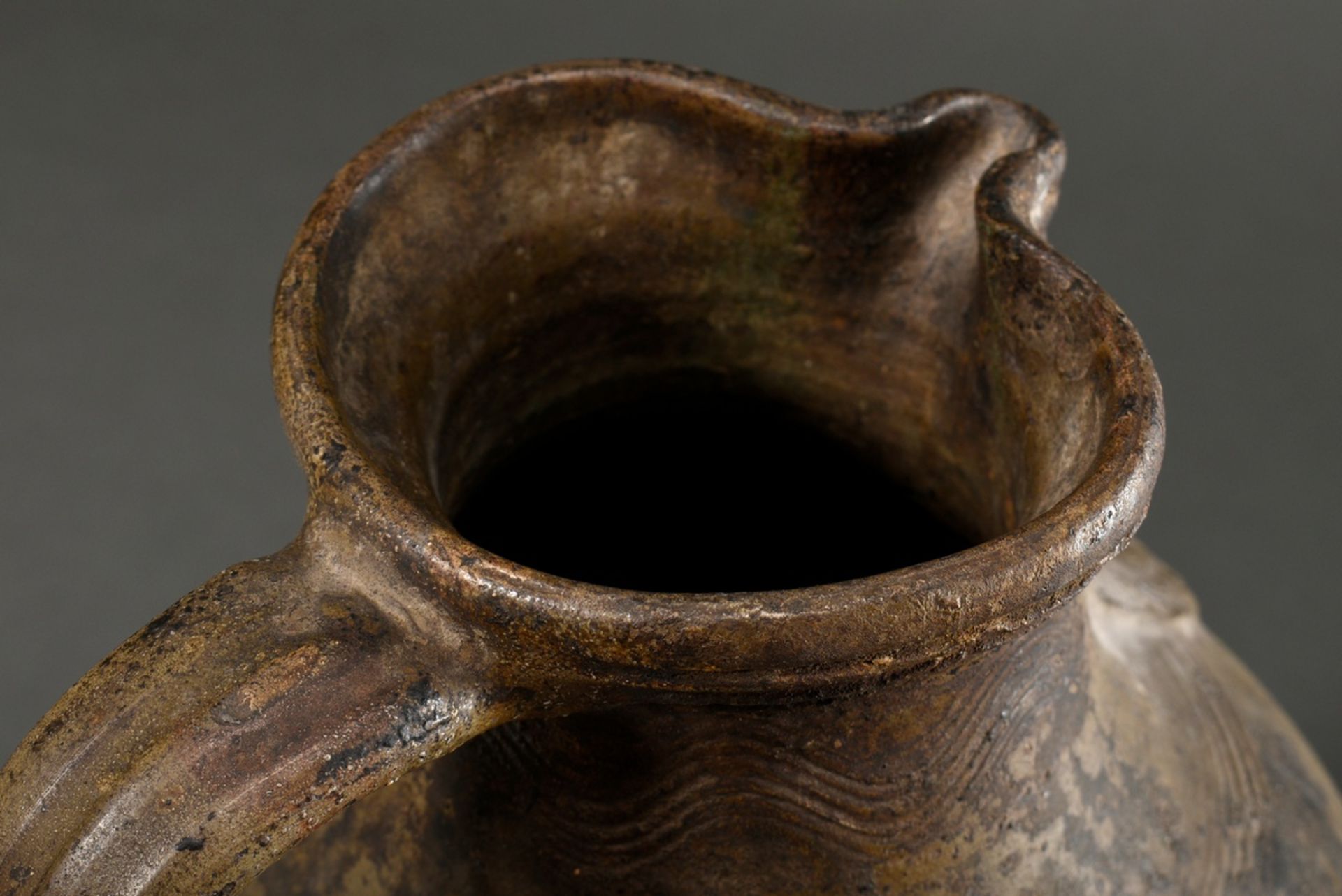 A large Pötzkanne or Bartmann jug with remnants of light brown salt glaze and "Bartmann mask" decor - Image 8 of 12