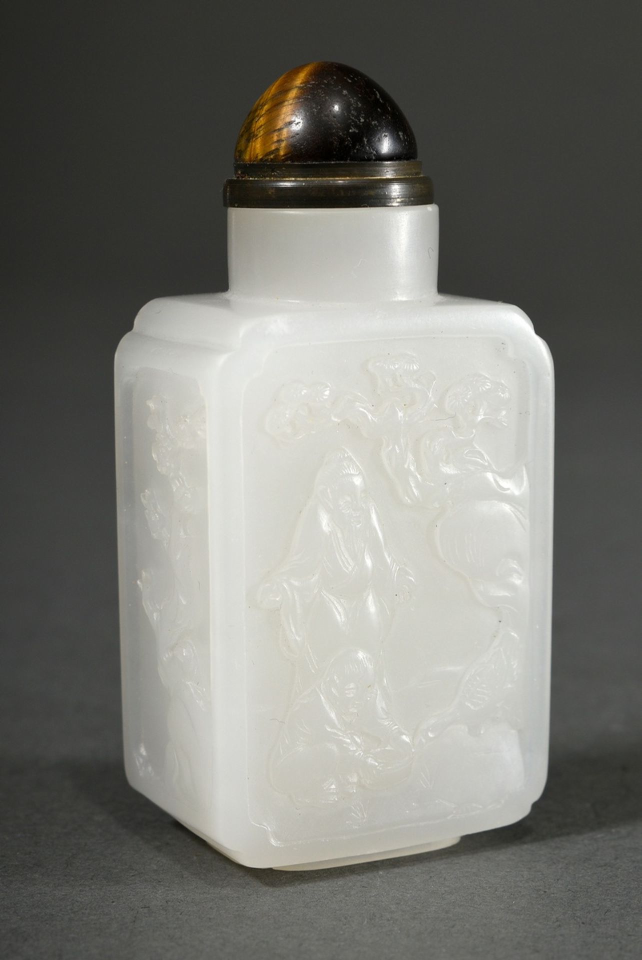 Fine white jade snuffbottle, all around with delicately cut relief scenes "Rocks, pines, bamboo, sc