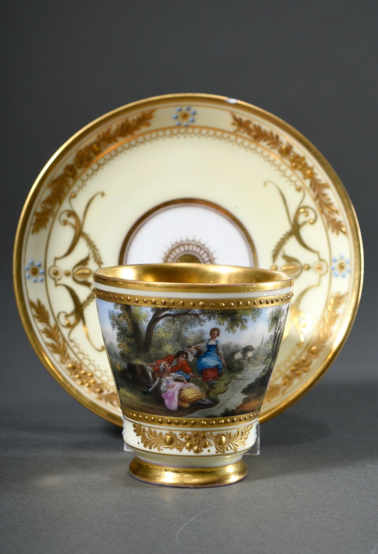 Dresden demitasse/saucer with polychrome painting " Watteau scene" and rich relief gilding on a lig