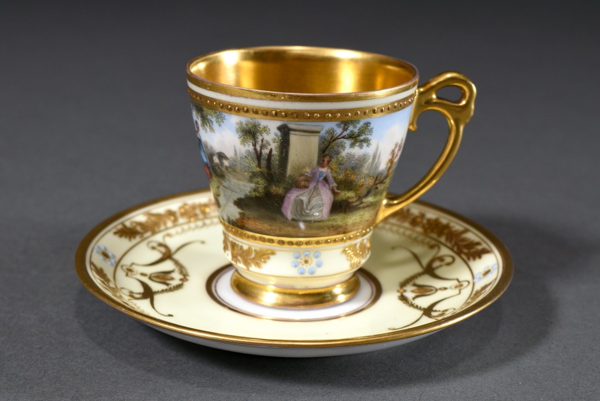 Dresden demitasse/saucer with polychrome painting " Watteau scene" and rich relief gilding on a lig - Image 3 of 7