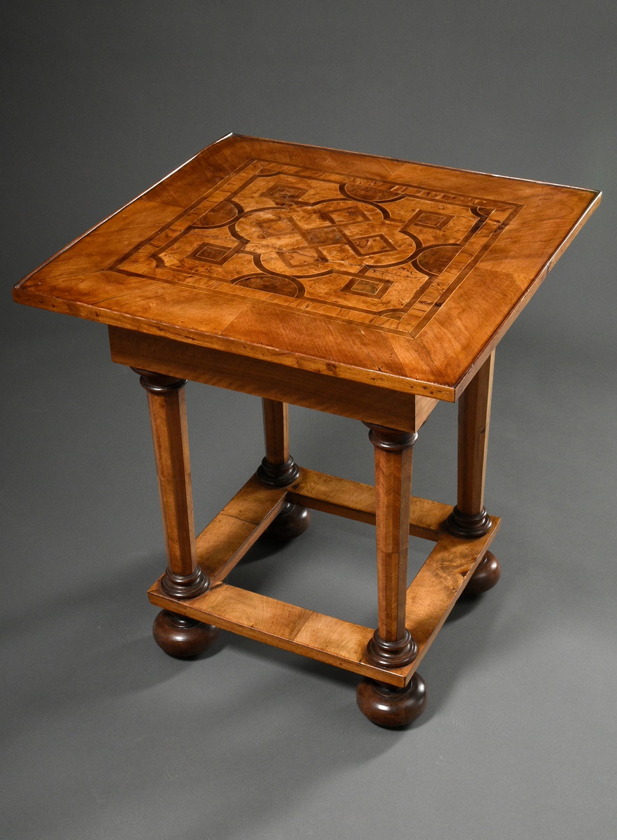 Square table with band inlays on the top and faceted legs with bar joints, hidden drawer in the fra